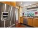 Stainless steel refrigerator with ice and water dispenser in modern kitchen at 1900 E Girard Pl # 608, Englewood, CO 80113