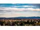 Expansive view of distant mountains beneath a sky streaked with fluffy white clouds at 1900 E Girard Pl # 608, Englewood, CO 80113