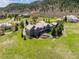 Aerial view of a large home surrounded by a green lawn and mature trees on a sunny day at 4749 Starfire Cir, Castle Rock, CO 80104