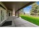 Beautiful covered patio and lush lawn offer the perfect setting for relaxation and outdoor enjoyment at 4749 Starfire Cir, Castle Rock, CO 80104