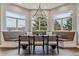 Charming dining area with a built-in bench, large windows, and scenic mountain views at 4749 Starfire Cir, Castle Rock, CO 80104