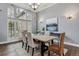 Elegant dining room with a large window, shutters, and modern decor at 4749 Starfire Cir, Castle Rock, CO 80104