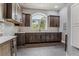 Well-lit kitchen with custom cabinets, stainless appliances and subway tile backsplash at 4749 Starfire Cir, Castle Rock, CO 80104