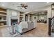 Inviting living area features a fireplace, built-in shelving, and an open layout for relaxed living at 4749 Starfire Cir, Castle Rock, CO 80104