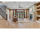 Bright living room with a fireplace, large windows, and an elegant staircase, perfect for entertaining at 4749 Starfire Cir, Castle Rock, CO 80104