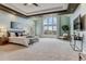 Spacious main bedroom with a tray ceiling, large windows, and a scenic view at 4749 Starfire Cir, Castle Rock, CO 80104