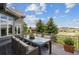 Beautiful patio with a large dining table and stunning views of the surrounding landscape at 4749 Starfire Cir, Castle Rock, CO 80104