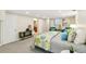 Basement bedroom with a queen bed, carpeted floors, and neutral colored walls at 3055 N Albion St, Denver, CO 80207
