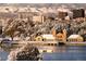 Scenic cityscape view in winter with park, lake, and mountains in the background at 3055 N Albion St, Denver, CO 80207
