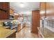Classic kitchen features warm wood cabinetry, granite countertops, stainless steel appliances and lots of natural light at 3055 N Albion St, Denver, CO 80207