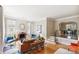 Elegant living room with hardwood floors, a fireplace, and an open layout at 3055 N Albion St, Denver, CO 80207
