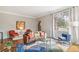 Cozy living room featuring hardwood floors and a large window for natural light at 3055 N Albion St, Denver, CO 80207
