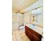 Bathroom featuring a sliding shower door, toilet, wooden vanity with a marble sink and mirror at 605 S Alton Way # 7A, Denver, CO 80247