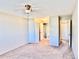 Bedroom view showcasing a ceiling fan, closets, and an attached bathroom at 605 S Alton Way # 7A, Denver, CO 80247