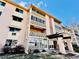 An exterior shot of the condo building showcasing its lovely landscaping and charming entrance at 605 S Alton Way # 7A, Denver, CO 80247