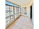 Sunroom with tiled floors, multiple windows and sliding door at 605 S Alton Way # 7A, Denver, CO 80247