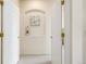 Hallway with carpet, interior door, and decorated niche in wall at 1747 N Washington St # C306, Denver, CO 80203