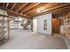 Spacious basement area with open ceiling, storage shelves, and potential for customized living space at 11418 Macon St, Commerce City, CO 80640