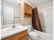 This bathroom features a vanity with ample lighting and a shower and tub combo at 11418 Macon St, Commerce City, CO 80640