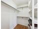 Walk-in closet with built-in shelving and railing for optimal storage and organization at 11418 Macon St, Commerce City, CO 80640