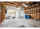 Spacious garage with concrete flooring, open ceiling, and ample room for vehicles and storage at 11418 Macon St, Commerce City, CO 80640