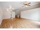 Spacious living area featuring hardwood floors and an open floor plan with plenty of light at 11418 Macon St, Commerce City, CO 80640