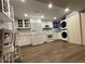 Basement kitchen with white shaker cabinets and laundry at 3480 W 96Th Ave, Westminster, CO 80031