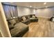 Finished basement with L-shaped sectional sofa at 3480 W 96Th Ave, Westminster, CO 80031