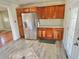 Bright kitchen with stainless steel appliances and wood cabinets at 3480 W 96Th Ave, Westminster, CO 80031