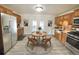 Modern kitchen featuring stainless steel appliances and wood cabinets at 3480 W 96Th Ave, Westminster, CO 80031