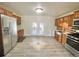 Kitchen with stainless steel appliances and access to backyard at 3480 W 96Th Ave, Westminster, CO 80031