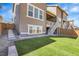 Backyard featuring a manicured lawn, patio and a exterior view of the home at 9022 Spaulding St, Parker, CO 80134