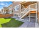 Charming home featuring low maintenance backyard, stone pavers, and stairs leading to a second story porch at 9022 Spaulding St, Parker, CO 80134