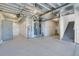 Unfinished basement space awaiting customization, with exposed utilities and a stairwell at 9022 Spaulding St, Parker, CO 80134