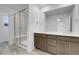 Bathroom with double vanity, spacious shower, and bright, airy atmosphere at 9022 Spaulding St, Parker, CO 80134