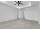 Spacious carpeted bedroom with ample natural light, recessed lighting, and multiple doors at 9022 Spaulding St, Parker, CO 80134