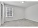 Comfortable bedroom features a window, neutral carpet, and ample natural light at 9022 Spaulding St, Parker, CO 80134