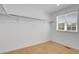 Bright closet space featuring a window for natural light and includes built-in shelving and hanging rods at 9022 Spaulding St, Parker, CO 80134