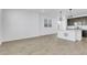 Bright living space featuring durable plank flooring, shiplap accents and dark cabinets at 9022 Spaulding St, Parker, CO 80134