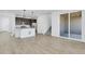 Spacious open-concept living area featuring contemporary finishes and durable plank flooring at 9022 Spaulding St, Parker, CO 80134