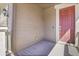 Inviting covered porch with a charming, painted front door and stylish exterior light fixture at 9022 Spaulding St, Parker, CO 80134
