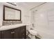 Bathroom features a sleek vanity, updated fixtures, and shower with tub at 11937 E Harvard Ave # 102, Aurora, CO 80014
