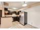 Bright kitchen featuring stainless steel appliances, modern cabinets, and light colored wood flooring at 11937 E Harvard Ave # 102, Aurora, CO 80014