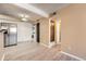 View of the stainless steel appliances, in-unit laundry, and modern floors at 11937 E Harvard Ave # 102, Aurora, CO 80014