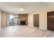 Living area features a stone fireplace, sliding door to balcony, and wood-look floors at 11937 E Harvard Ave # 102, Aurora, CO 80014