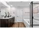 Bathroom features double vanity, granite countertops, and separate soaking tub and shower at 14836 Jersey Dr, Mead, CO 80542