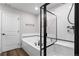 Bathroom features a large soaking tub and a separate shower with glass enclosure at 14836 Jersey Dr, Mead, CO 80542