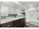 This bathroom features a single sink vanity and a shower-tub combo at 14836 Jersey Dr, Mead, CO 80542