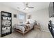 This bedroom has a fan, a window, and is decorated with modern decor at 14836 Jersey Dr, Mead, CO 80542