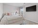 Bright bedroom featuring a plush bed, vanity, and a large window with lots of natural light at 14836 Jersey Dr, Mead, CO 80542